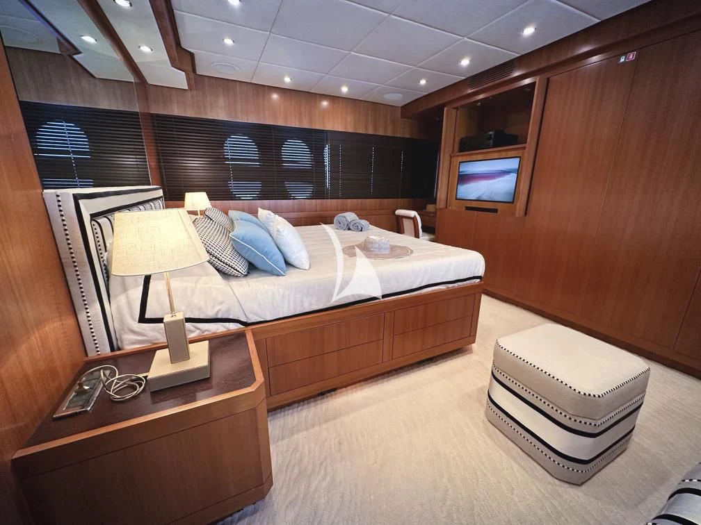 a hotel room with a bed and a tv aboard RAMSES II Yacht for Sale