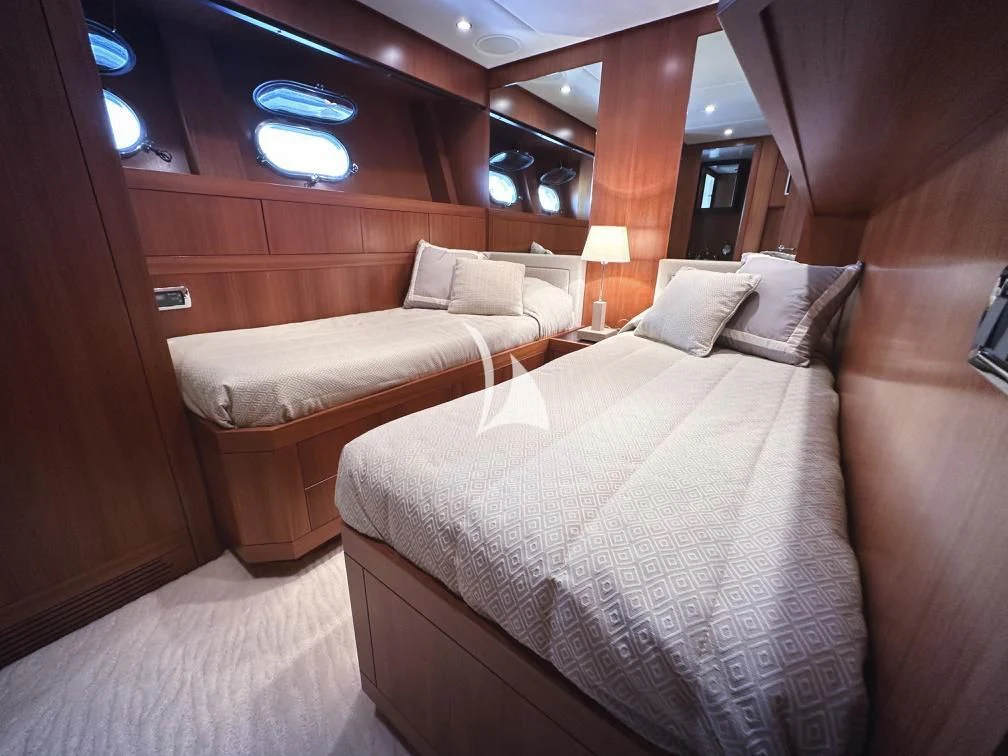 a room with two beds aboard RAMSES II Yacht for Sale