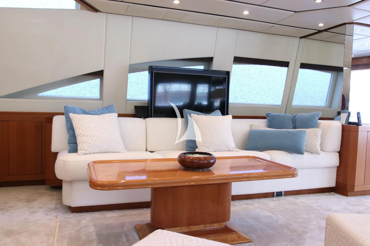a living room with a couch and a table aboard RAMSES II Yacht for Sale