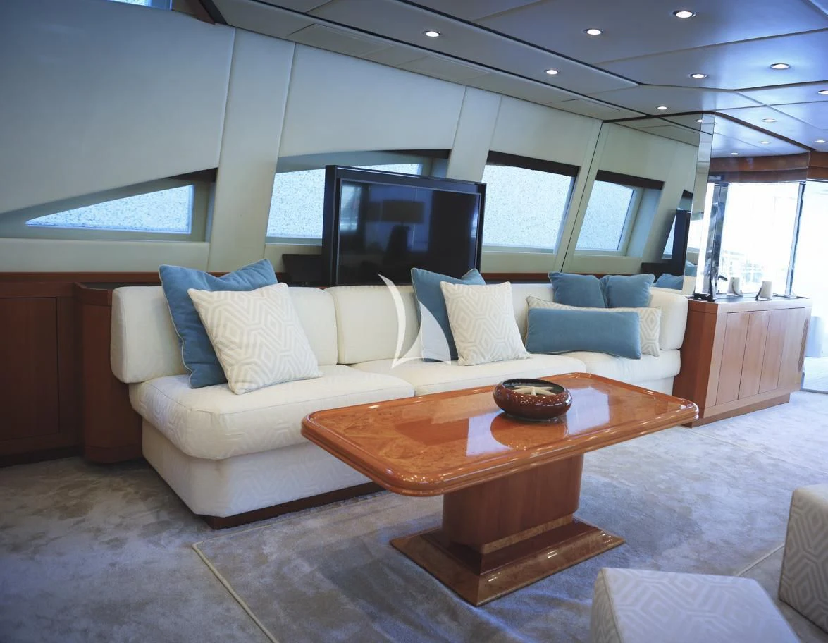 a living room with a couch and a table aboard RAMSES II Yacht for Sale