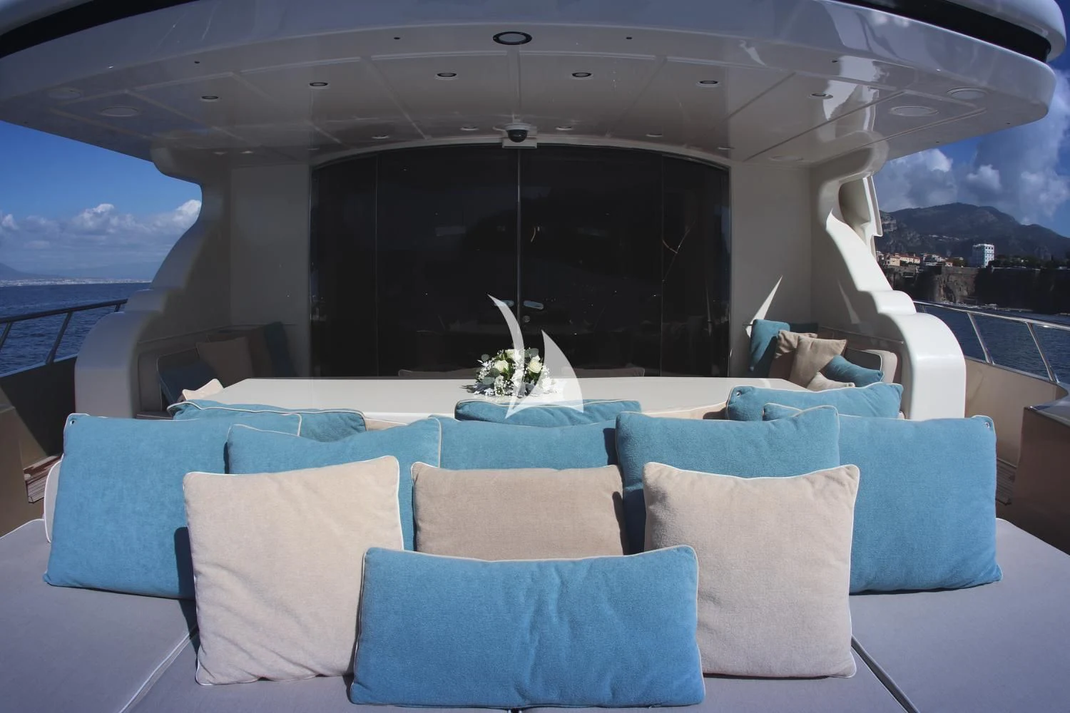 a room with a couch and a large window aboard RAMSES II Yacht for Sale