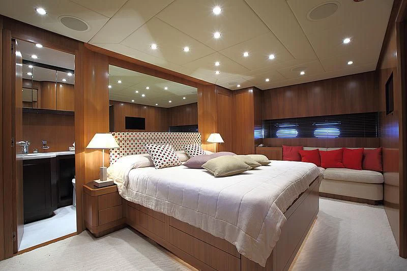 a room with a bed and a couch aboard RAMSES II Yacht for Sale