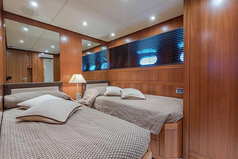 a room with a bed and a tv aboard RAMSES II Yacht for Sale
