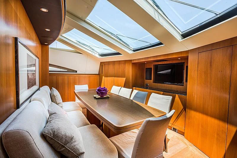 a living room with a couch and a television aboard RAMSES II Yacht for Sale