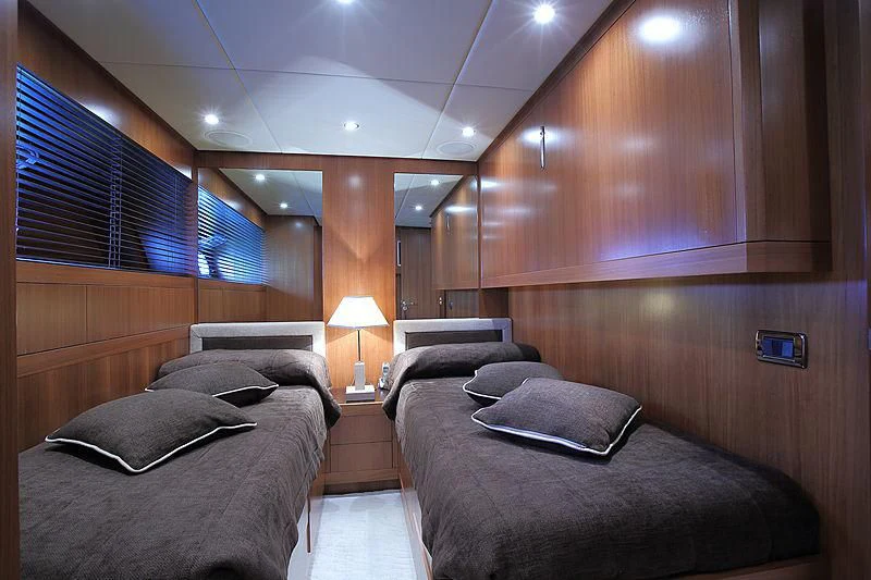 a room with a bed and a couch aboard RAMSES II Yacht for Sale