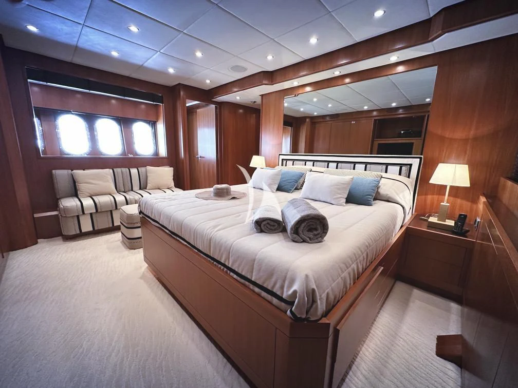 a room with a bed and a couch aboard RAMSES II Yacht for Sale