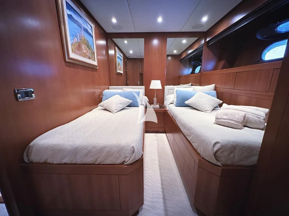a room with two beds aboard RAMSES II Yacht for Sale