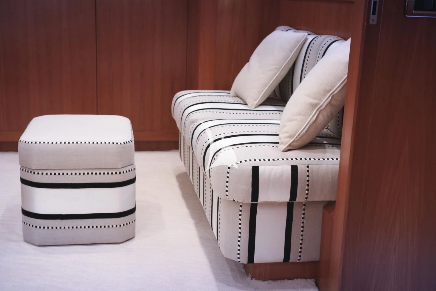a white chair next to a white chair aboard RAMSES II Yacht for Sale