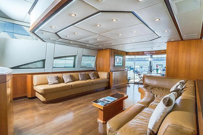 a living room with a couch and a coffee table aboard RAMSES II Yacht for Sale