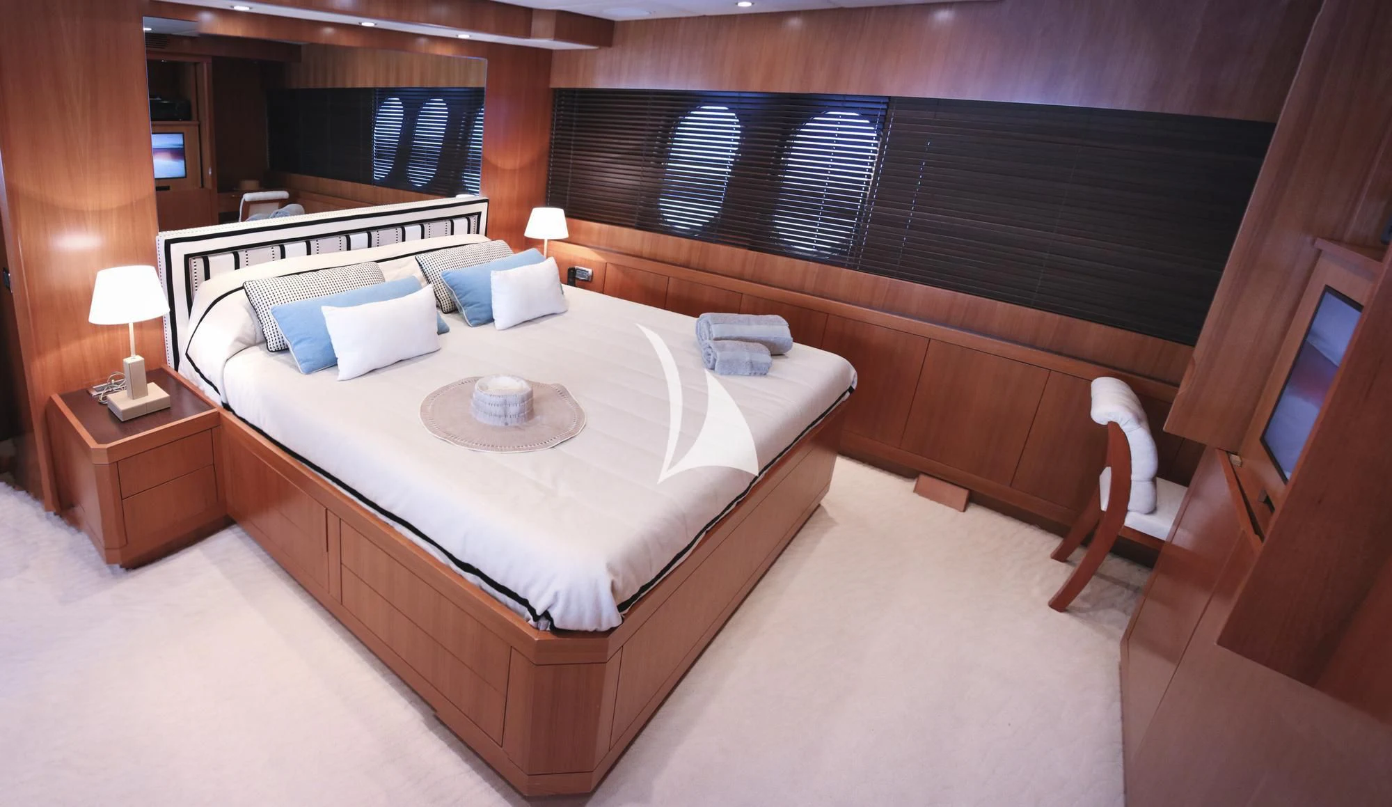 a room with a bed and a chair aboard RAMSES II Yacht for Sale
