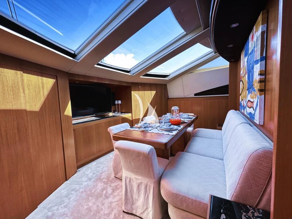 a room with a couch and a table aboard RAMSES II Yacht for Sale