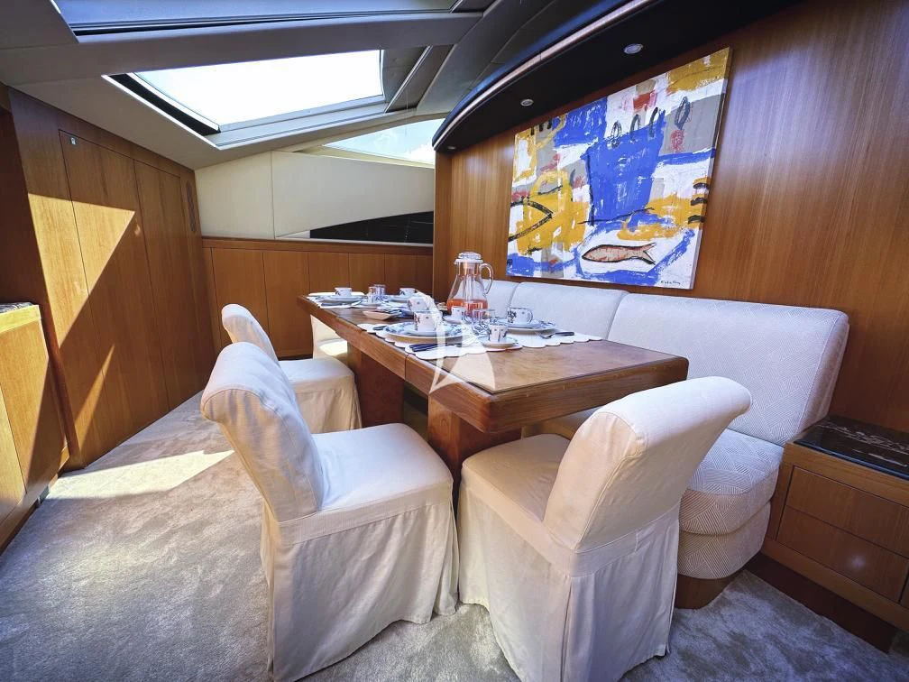 a room with a table and chairs aboard RAMSES II Yacht for Sale