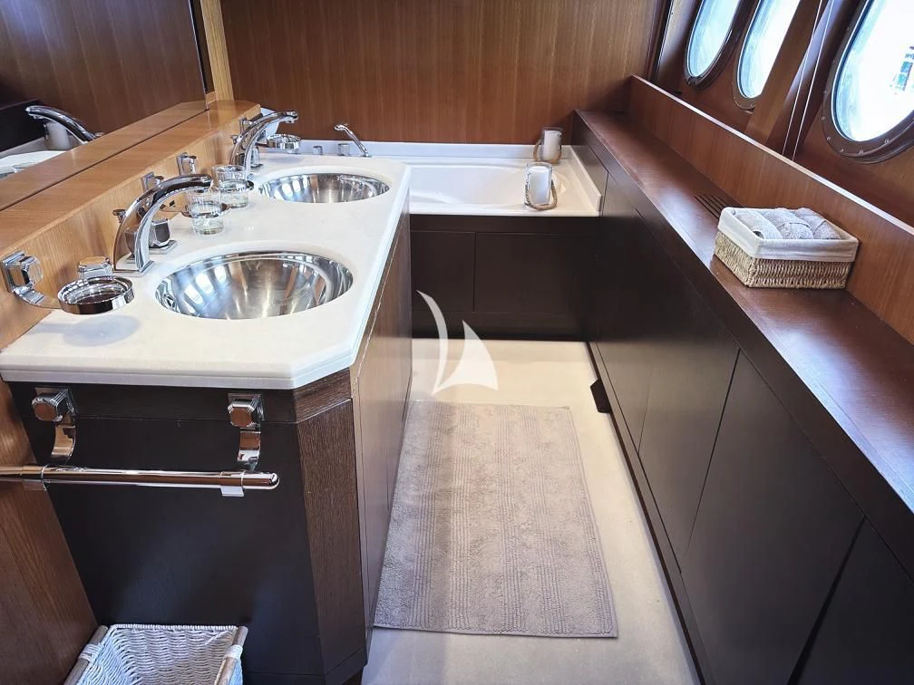 a bathroom with a sink and a mirror aboard RAMSES II Yacht for Sale