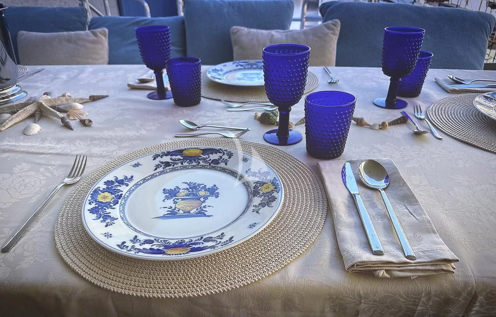 a table with plates and silverware aboard RAMSES II Yacht for Sale
