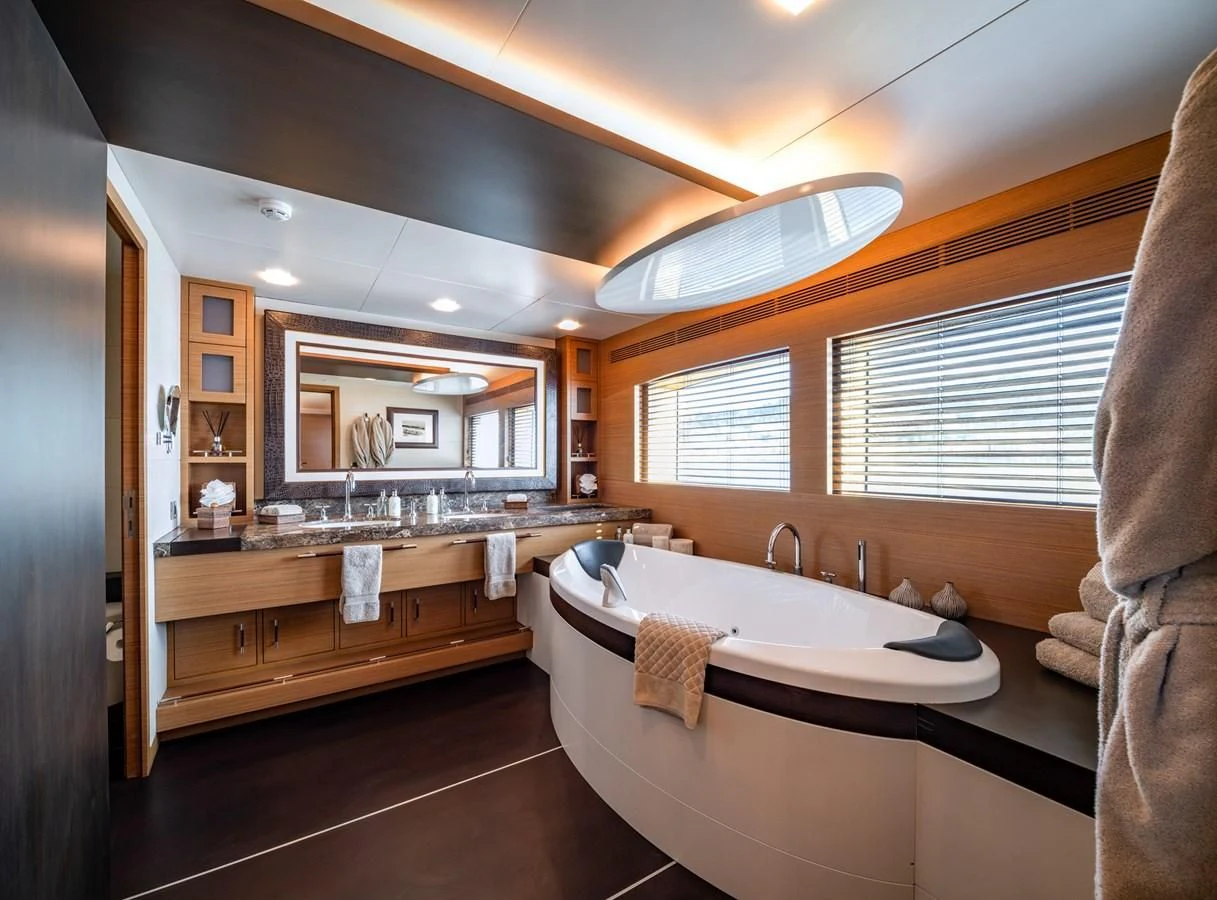 a bathroom with a large bathtub aboard QHT Yacht for Sale