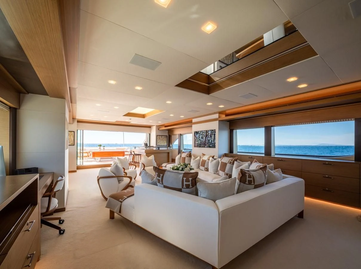 a living room with a large window aboard QHT Yacht for Sale