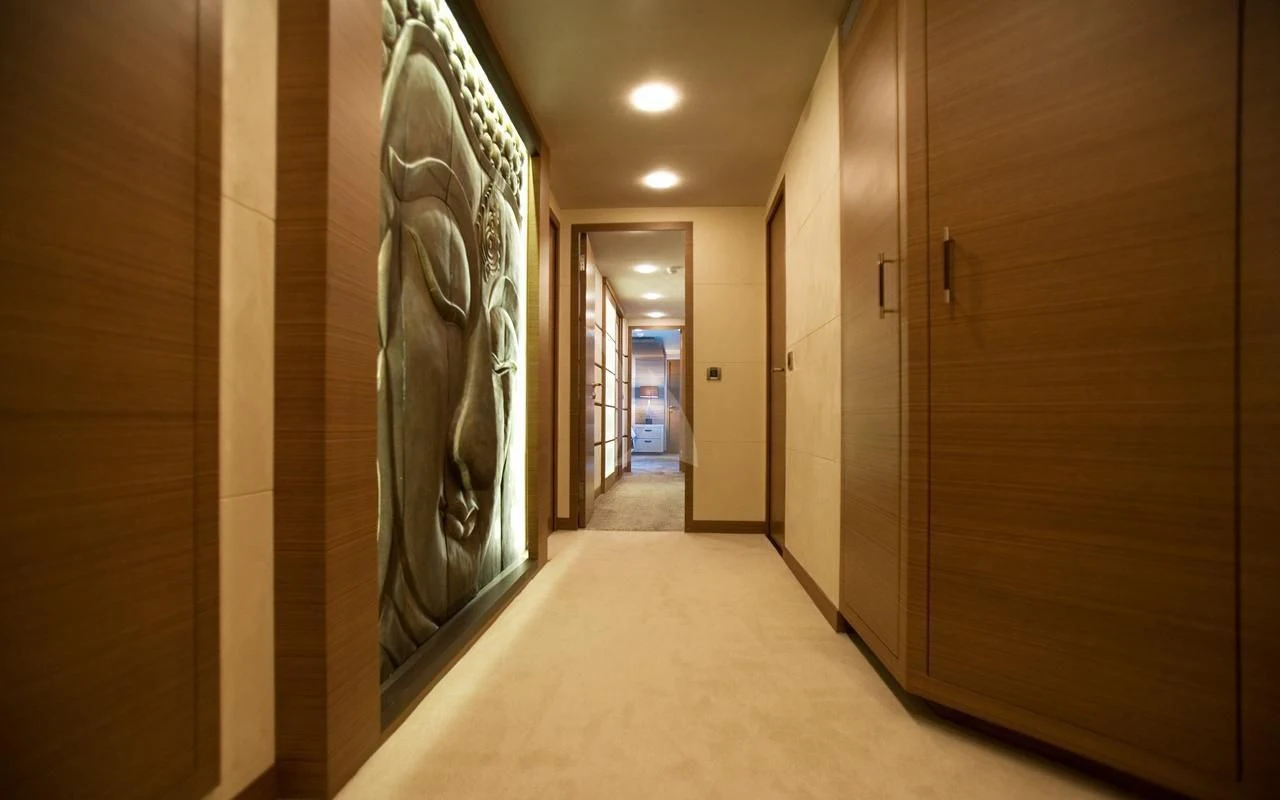 a hallway with a large mirror aboard QHT Yacht for Sale