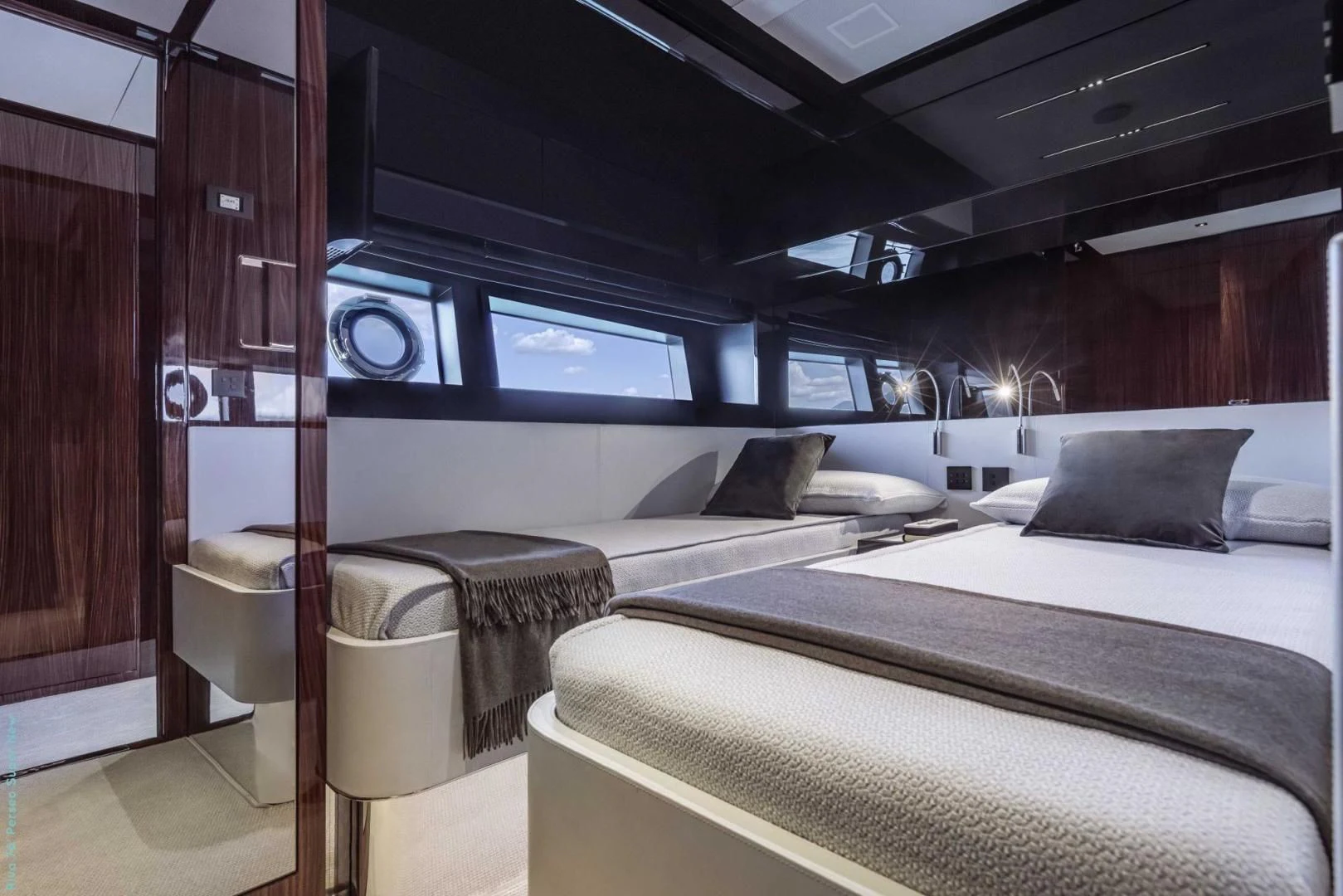 a room with a bed and a mirror aboard RECREATIONAL USE Yacht for Sale