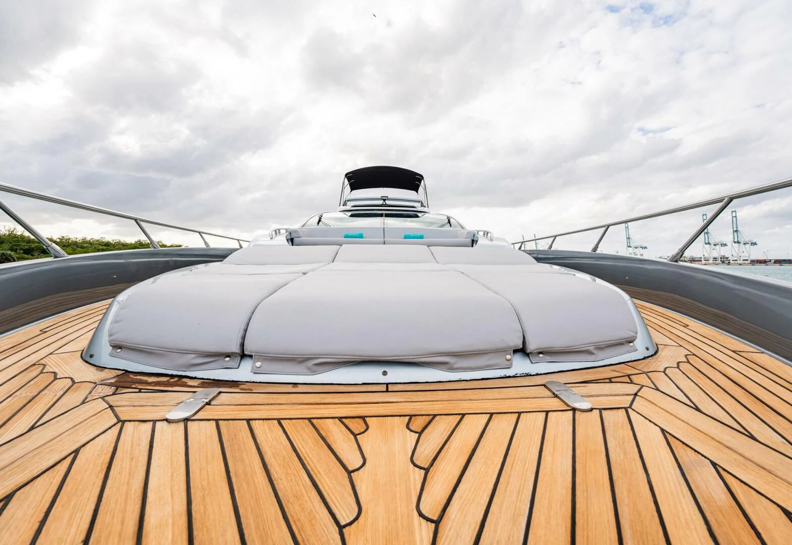 a white sports car on a wooden deck aboard RECREATIONAL USE Yacht for Sale
