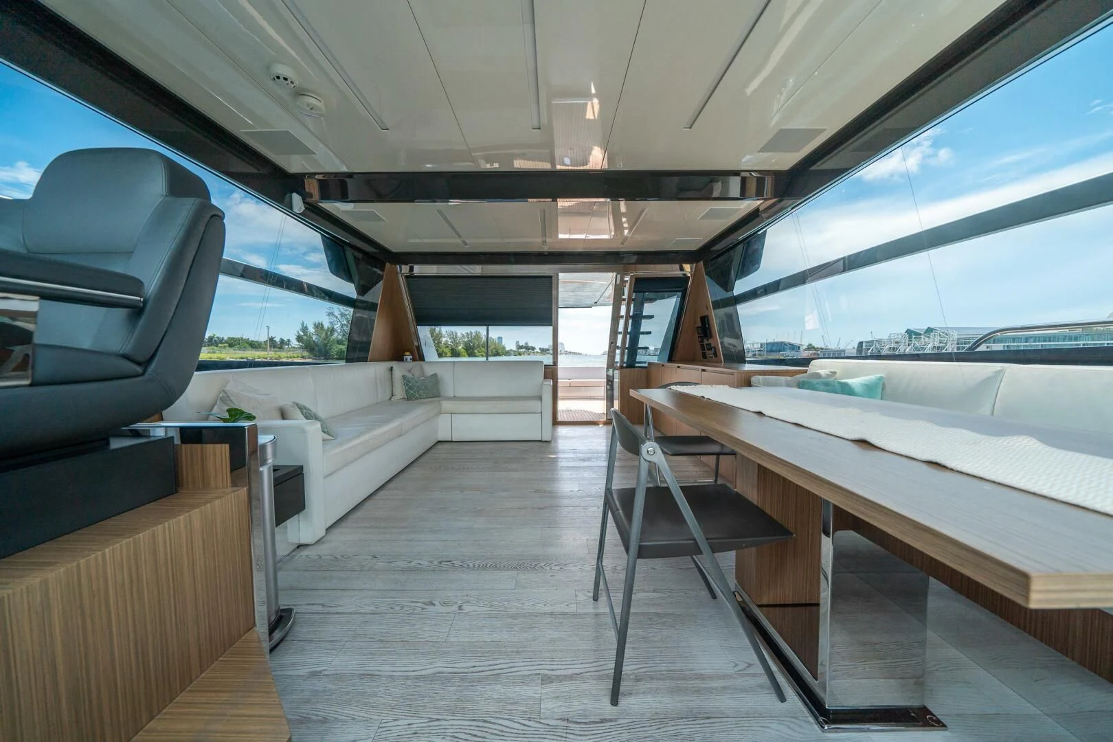 a room with a table and chairs aboard RECREATIONAL USE Yacht for Sale