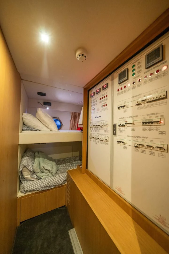 a room with a bed and a closet aboard RECREATIONAL USE Yacht for Sale