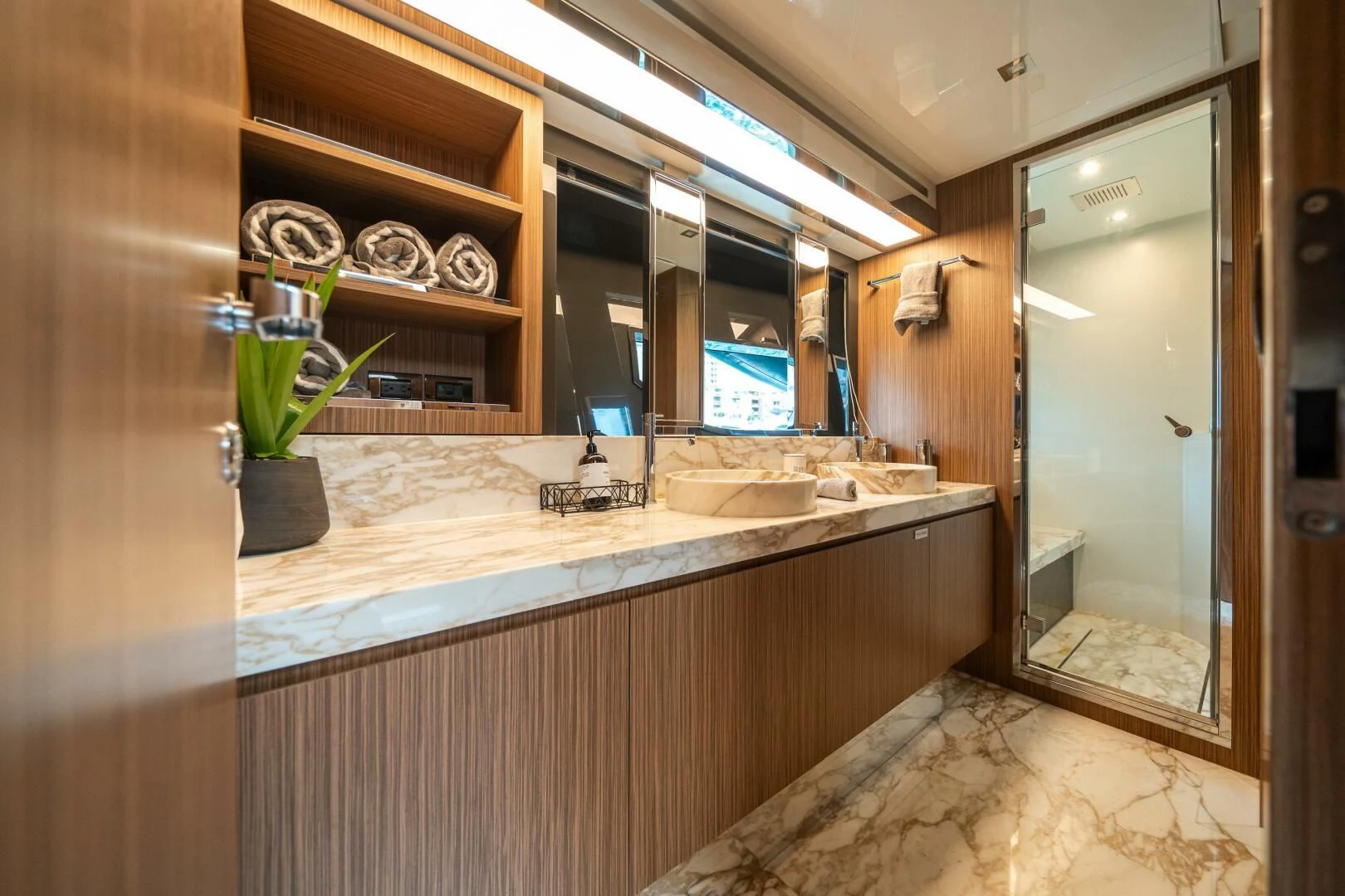 a bathroom with a countertop sink and a mirror aboard RECREATIONAL USE Yacht for Sale