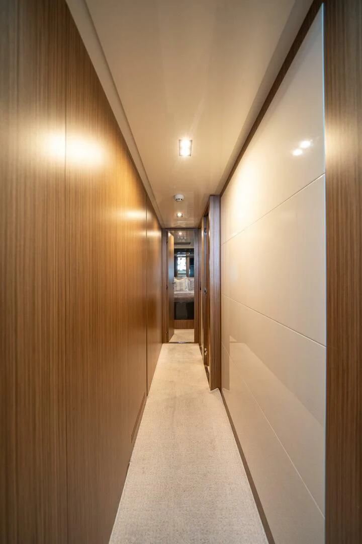 a hallway with a door and a hallway with doors aboard RECREATIONAL USE Yacht for Sale