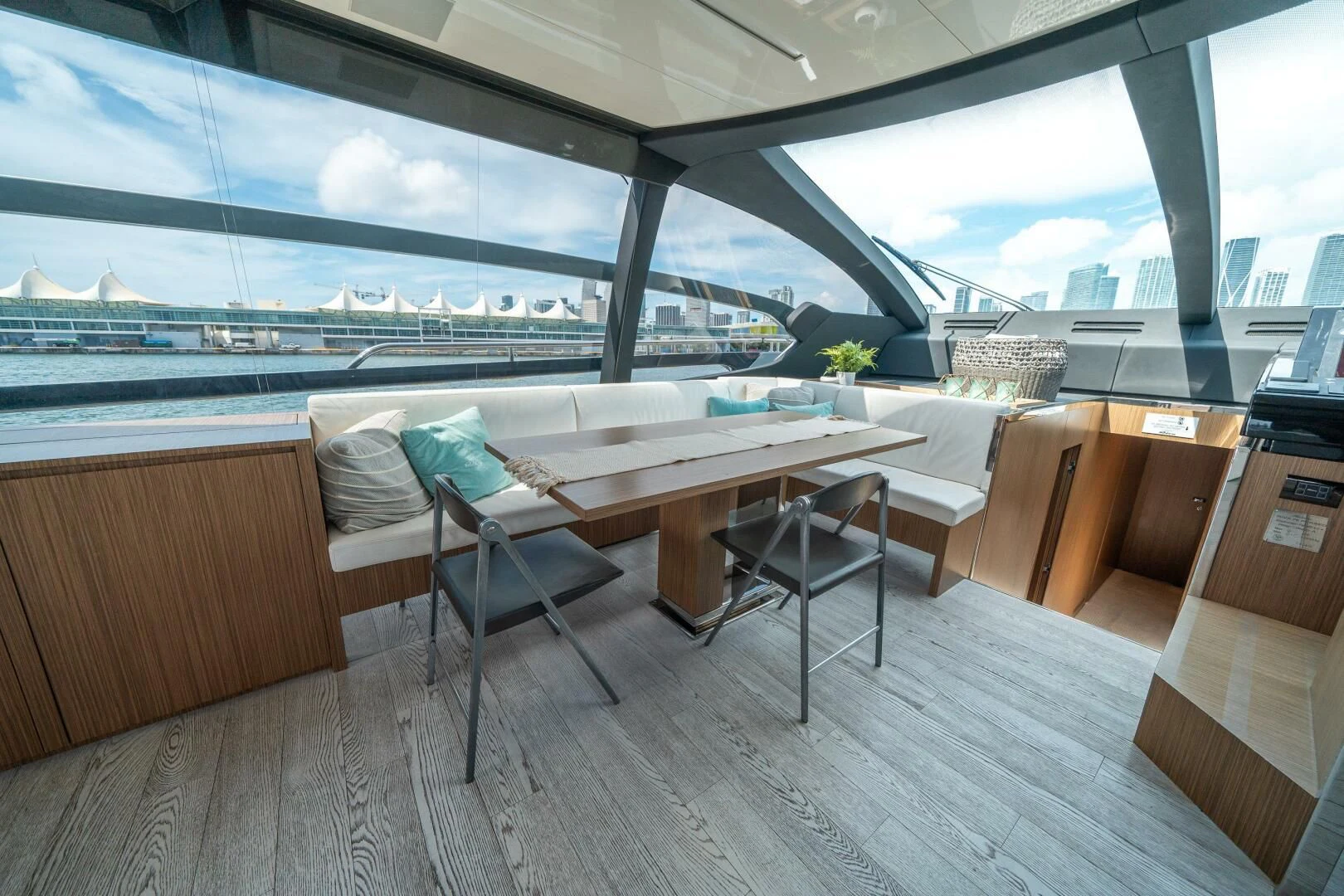 a room with a table and chairs aboard RECREATIONAL USE Yacht for Sale