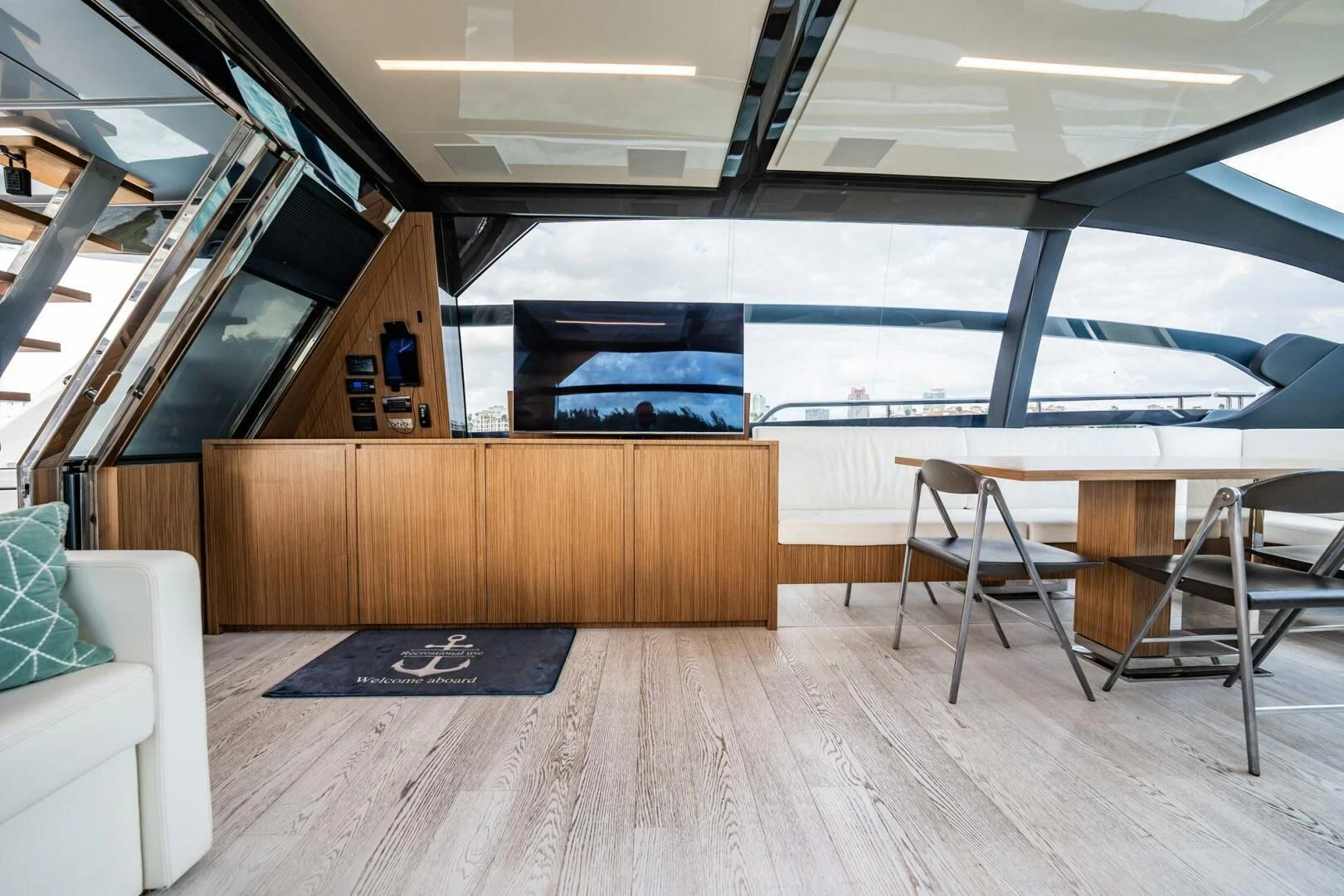a room with a table and chairs aboard RECREATIONAL USE Yacht for Sale