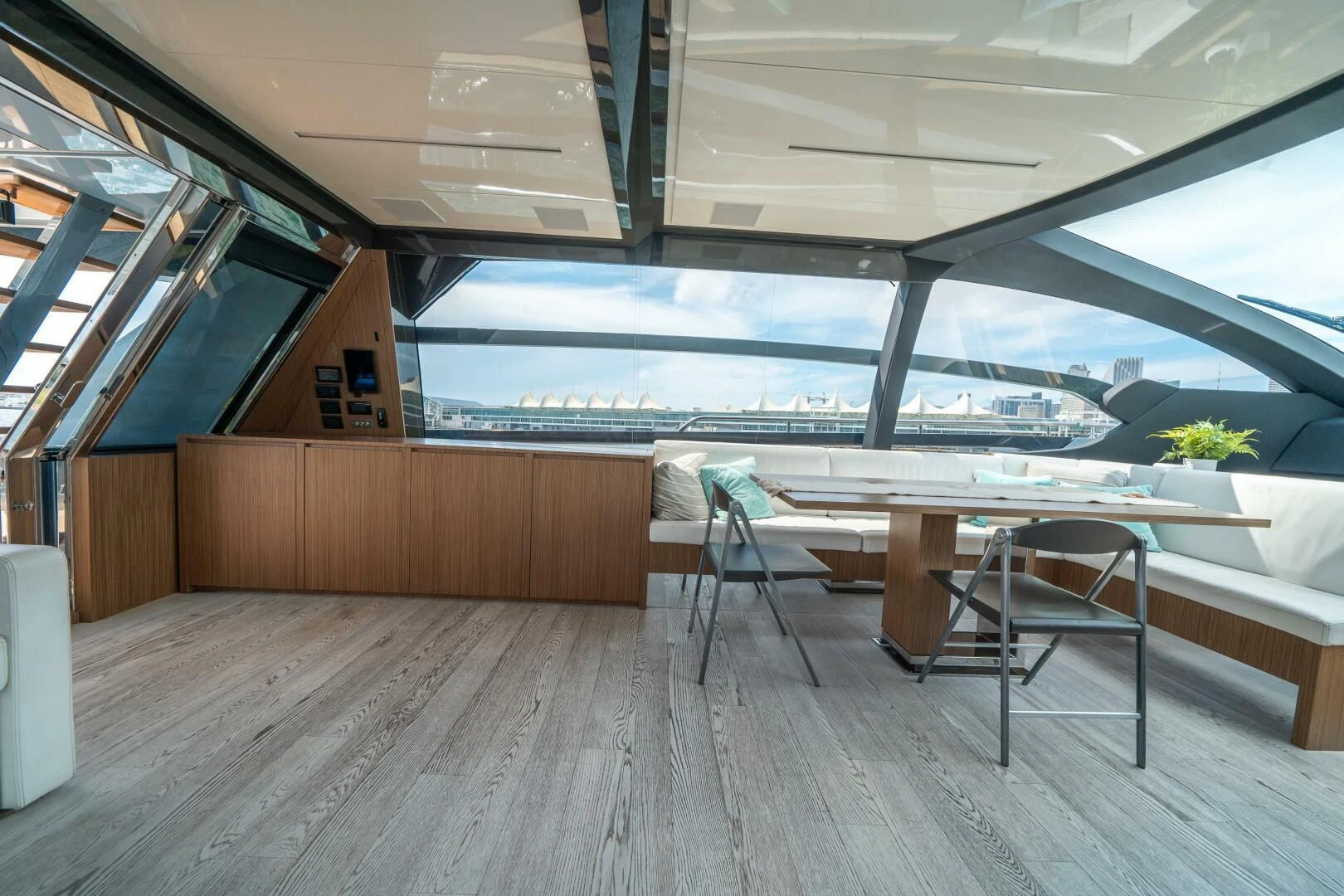 a room with a table and chairs aboard RECREATIONAL USE Yacht for Sale