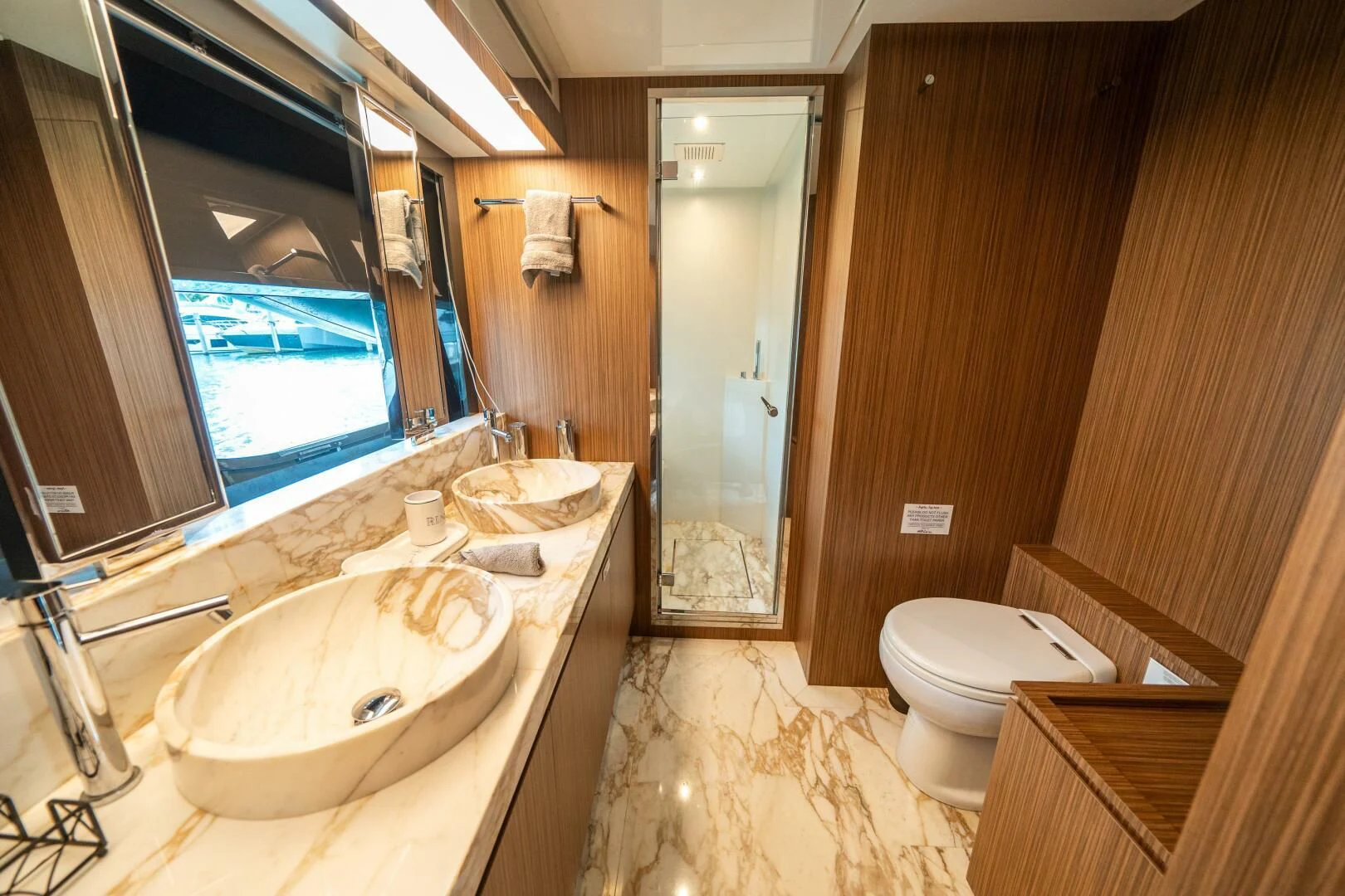 a bathroom with a sink toilet and a shower aboard RECREATIONAL USE Yacht for Sale