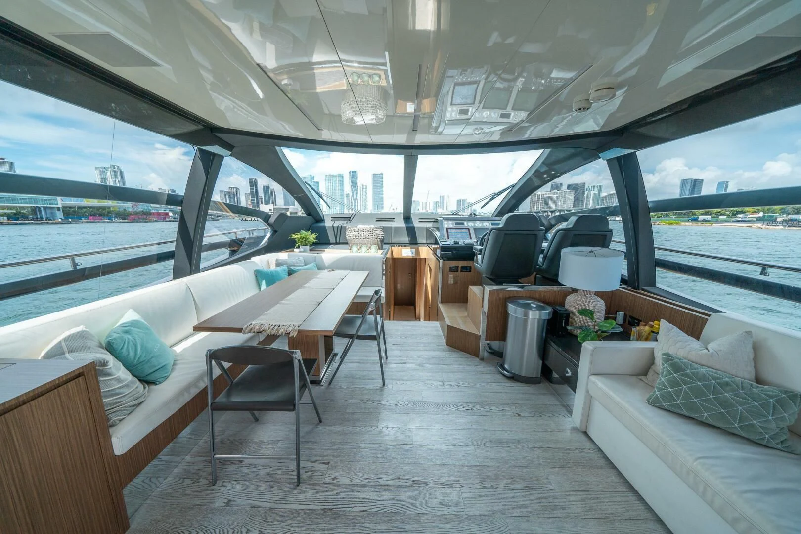 a room with a couch and a table and chairs aboard RECREATIONAL USE Yacht for Sale