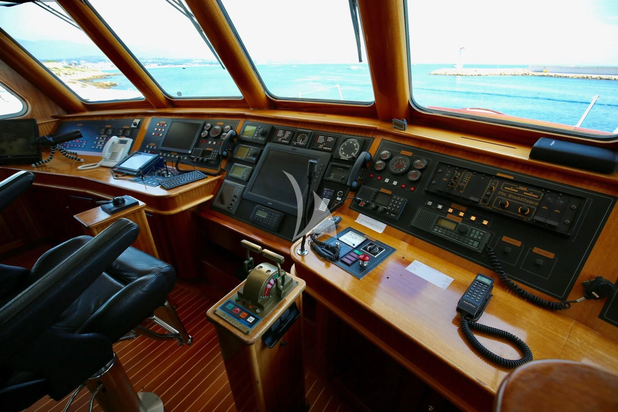 a desk with a computer and other electronics on it aboard SEA LION Yacht for Sale