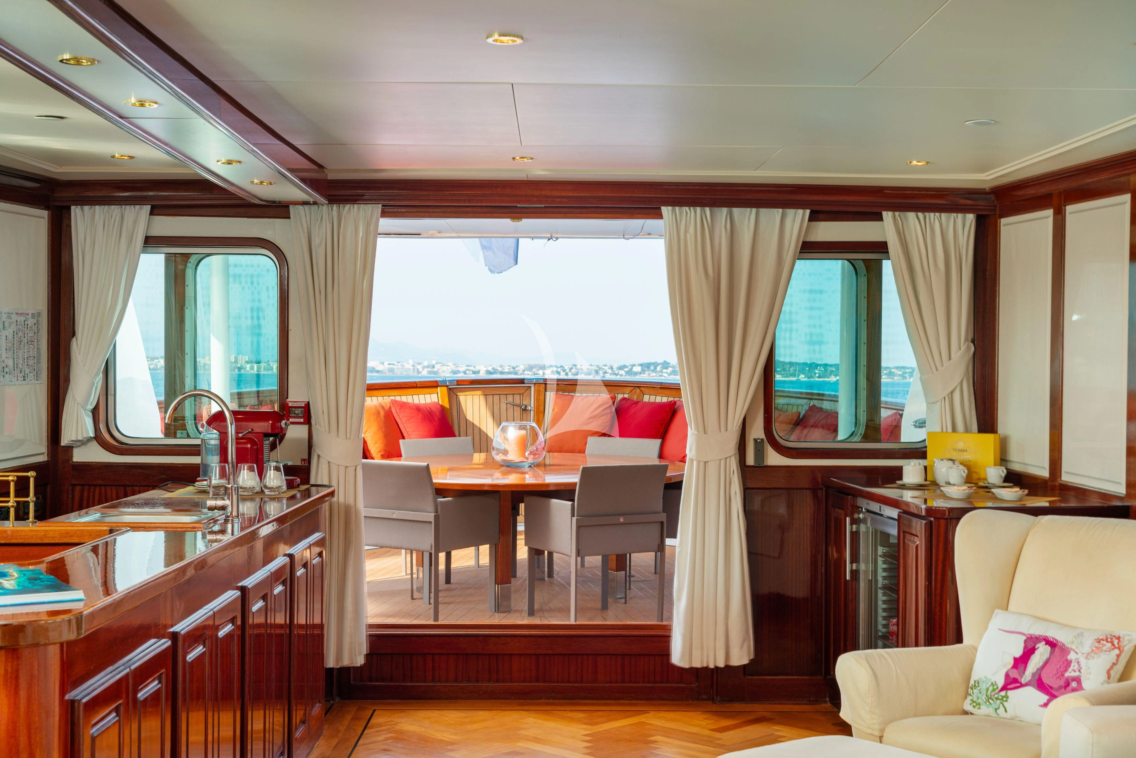 a kitchen with a dining table aboard SEA LION Yacht for Sale