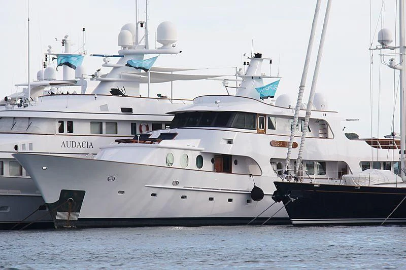 a few white yachts in the water aboard SEA LION Yacht for Sale