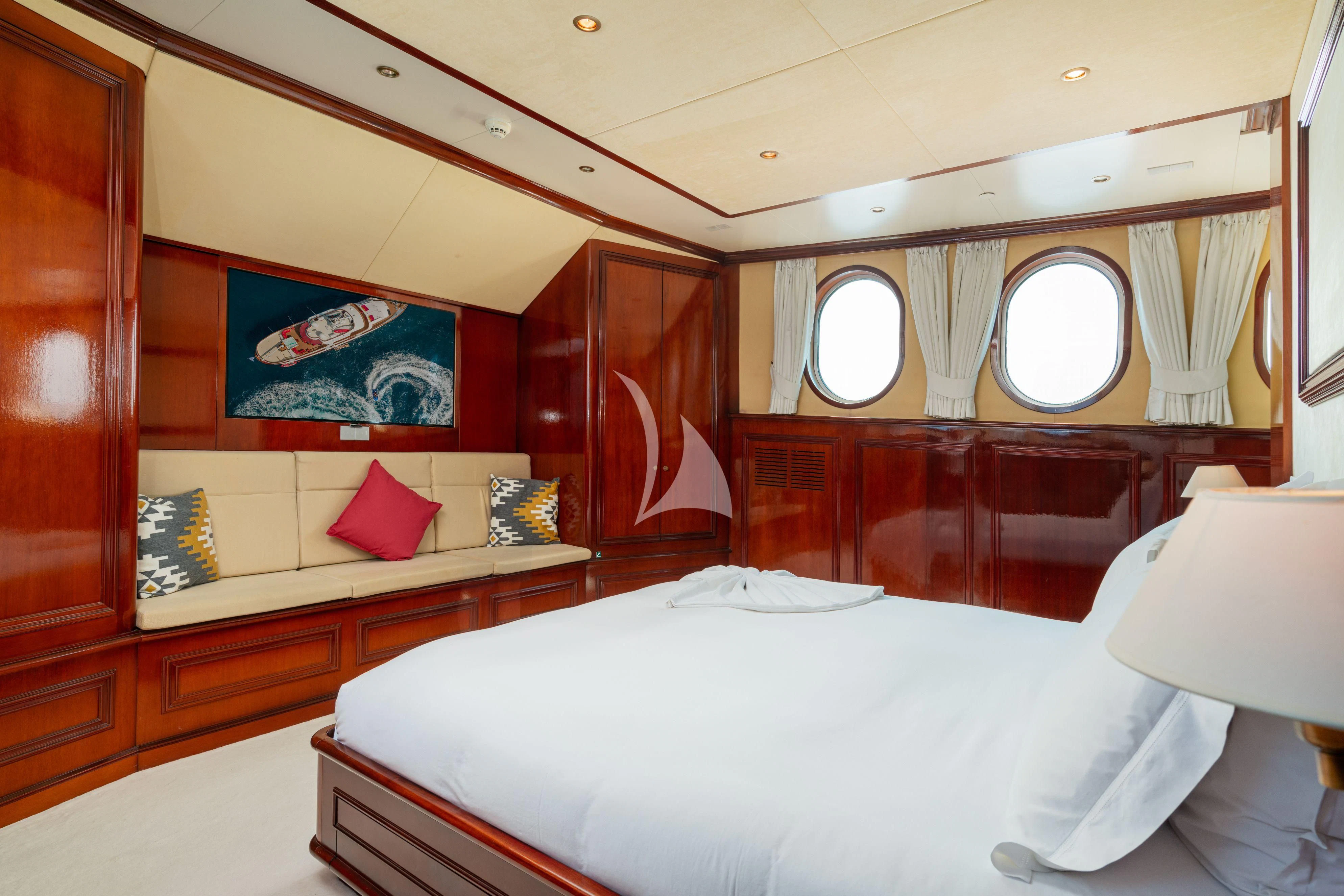 a room with a bed and a window aboard SEA LION Yacht for Sale