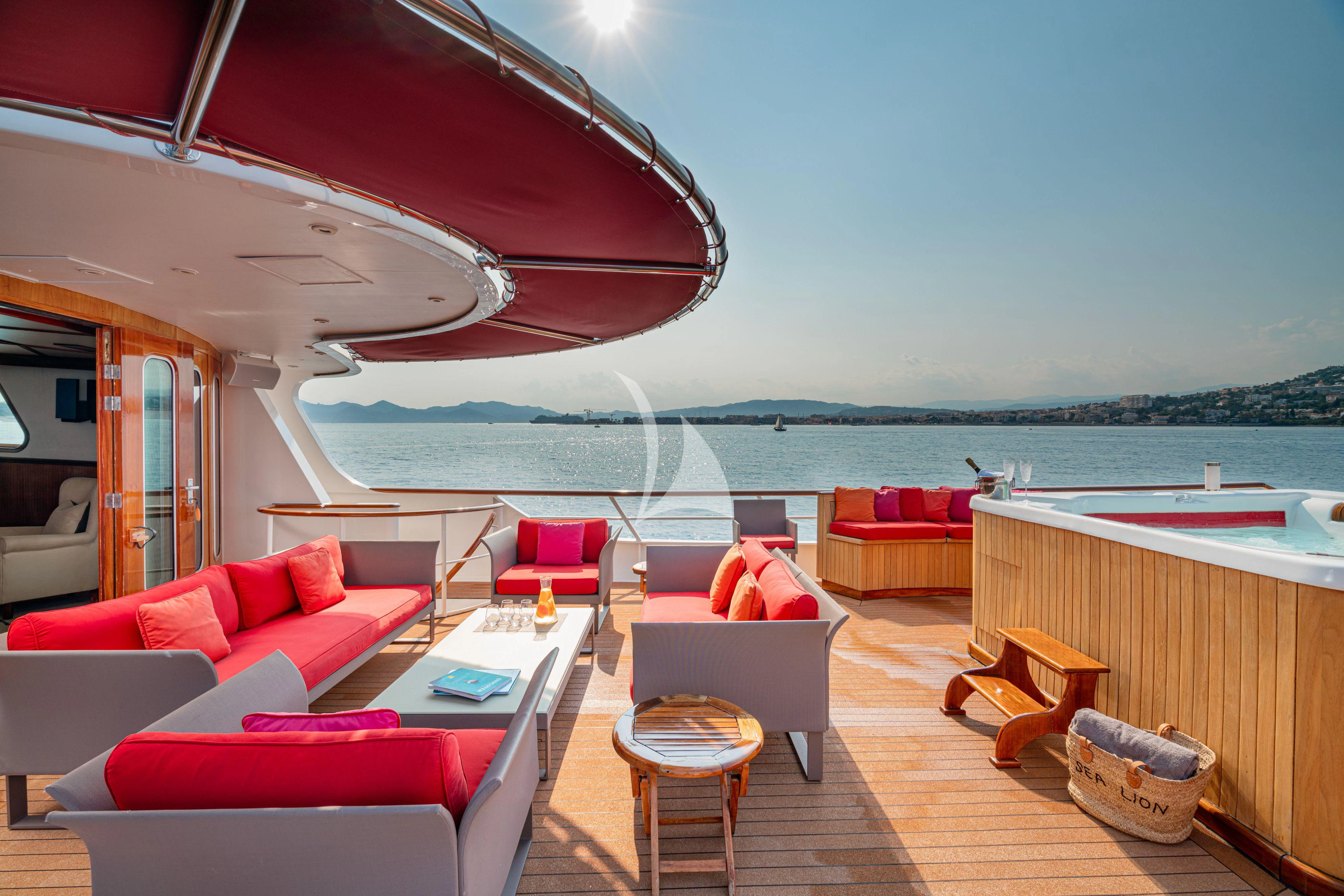 a boat is parked on the water aboard SEA LION Yacht for Sale