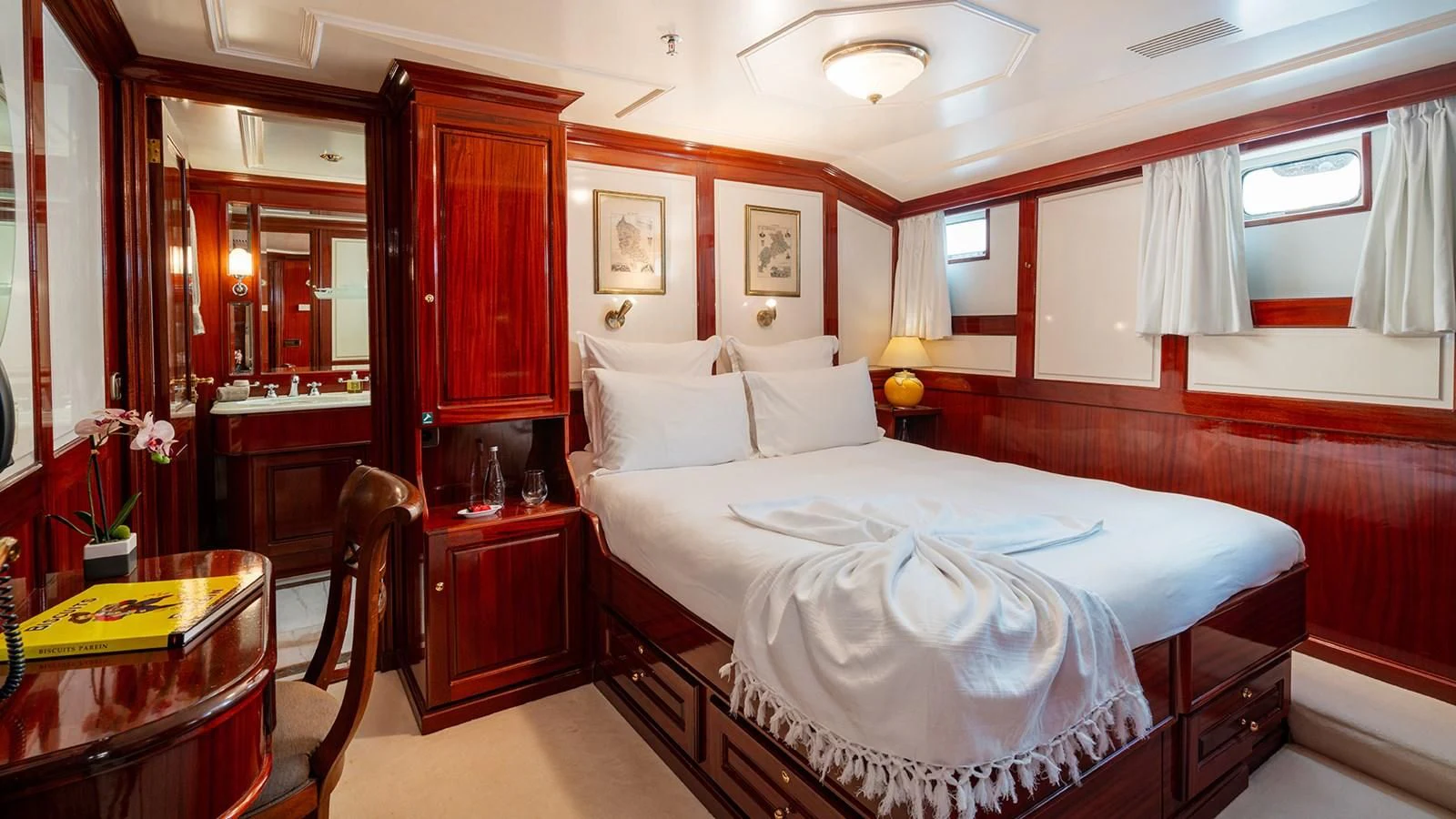 a room with a bed and a desk aboard SEA LION Yacht for Sale