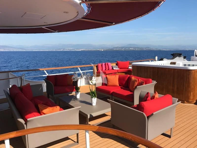 a room with a table and chairs aboard SEA LION Yacht for Sale