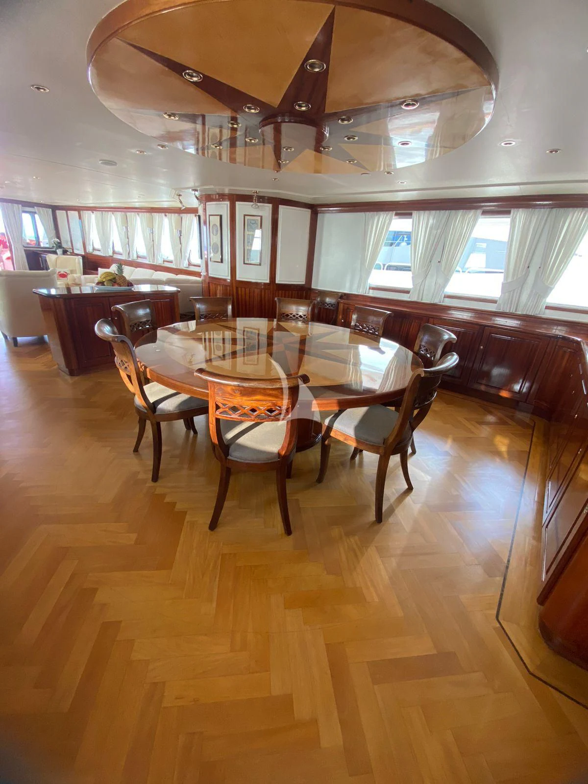 a room with a table and chairs aboard SEA LION Yacht for Sale