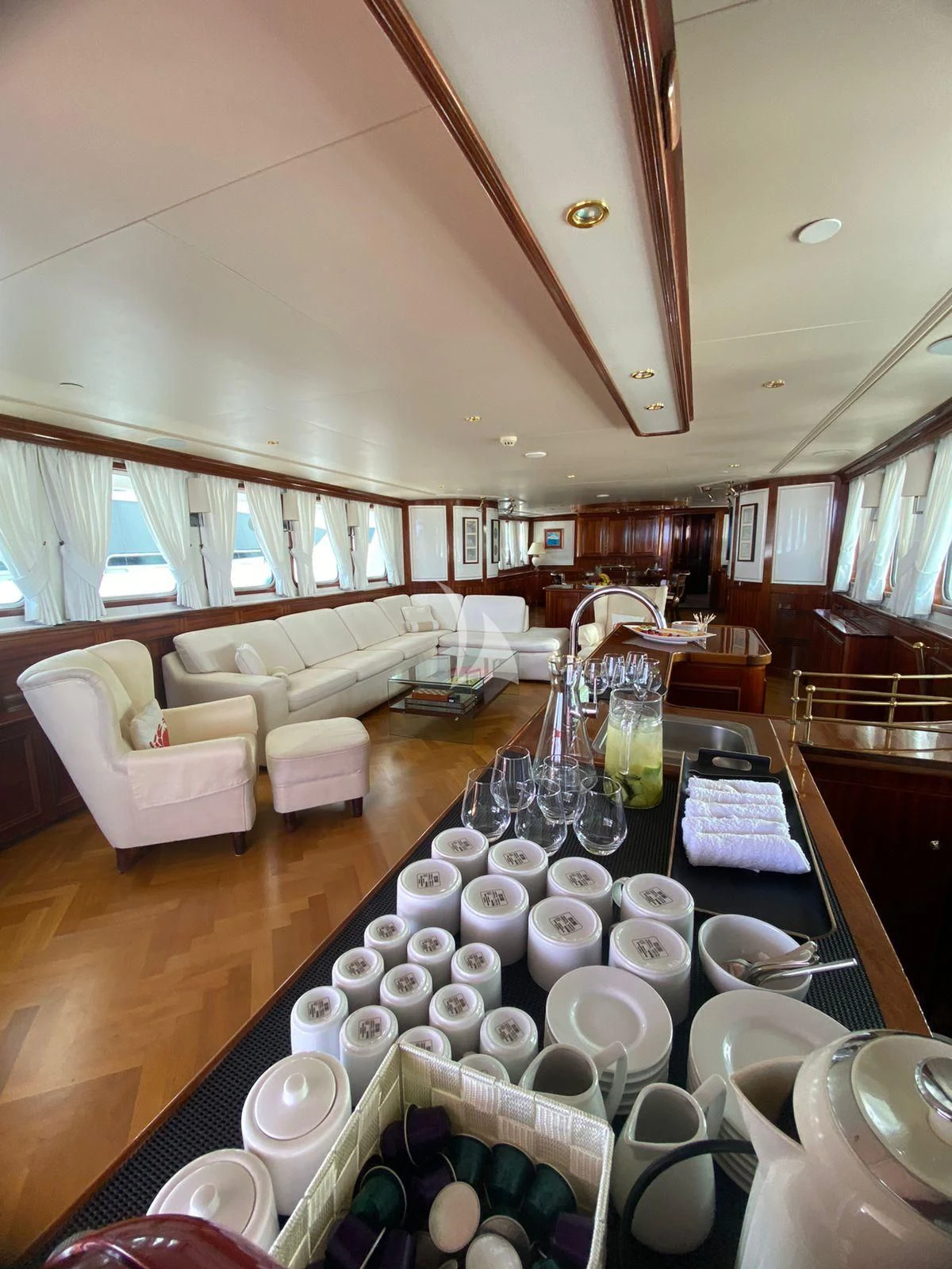 a table with plates and cups on it aboard SEA LION Yacht for Sale