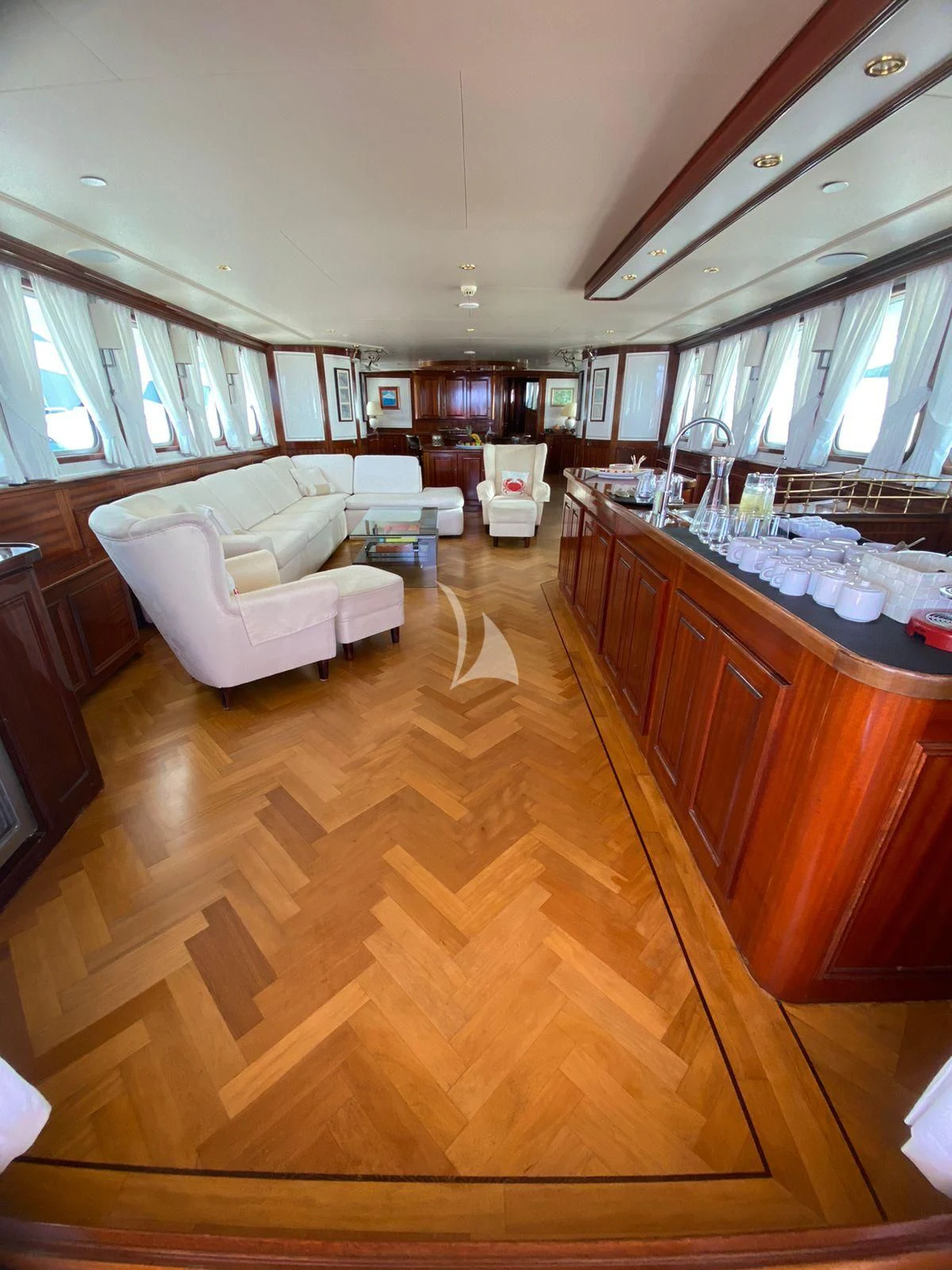 a kitchen with a wood floor aboard SEA LION Yacht for Sale