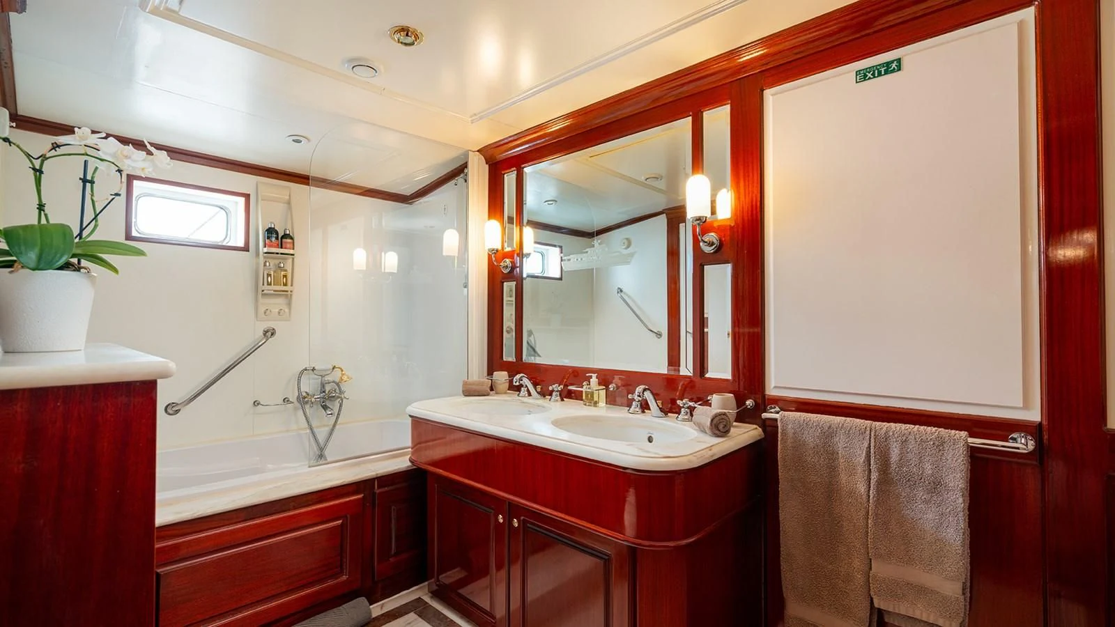 a bathroom with red cabinets aboard SEA LION Yacht for Sale