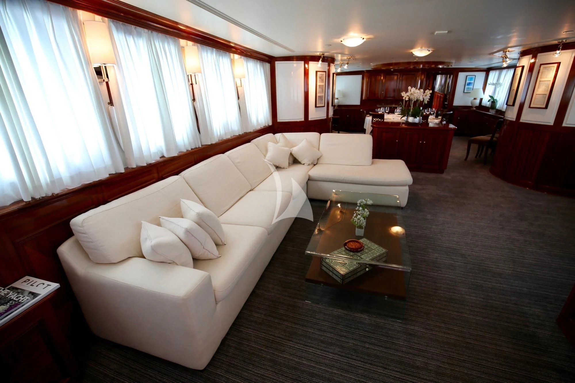 a living room with a large couch aboard SEA LION Yacht for Sale