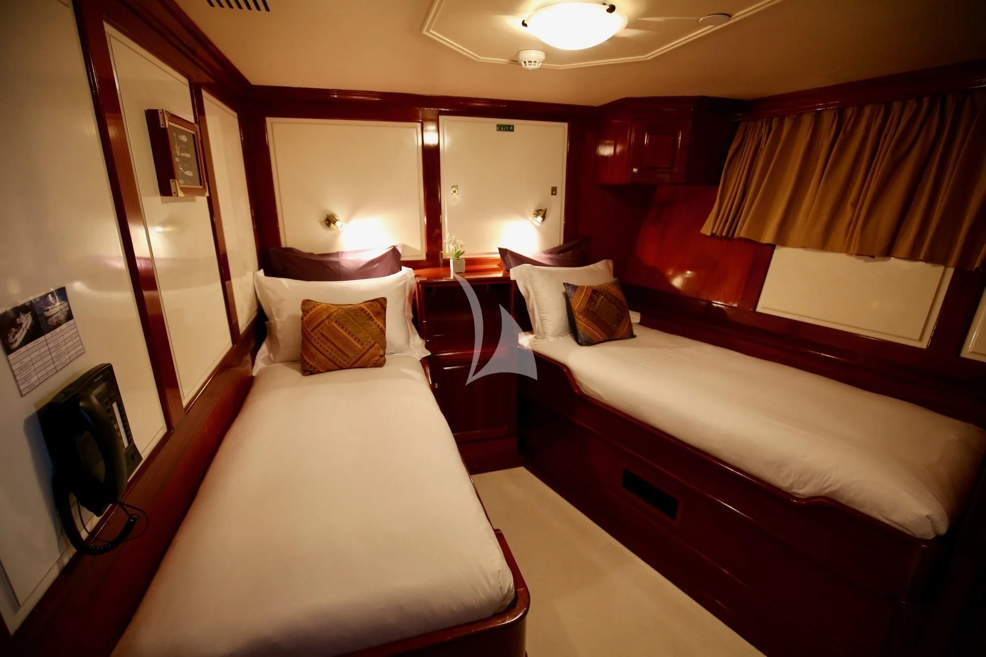 a room with a bed and a mirror aboard SEA LION Yacht for Sale