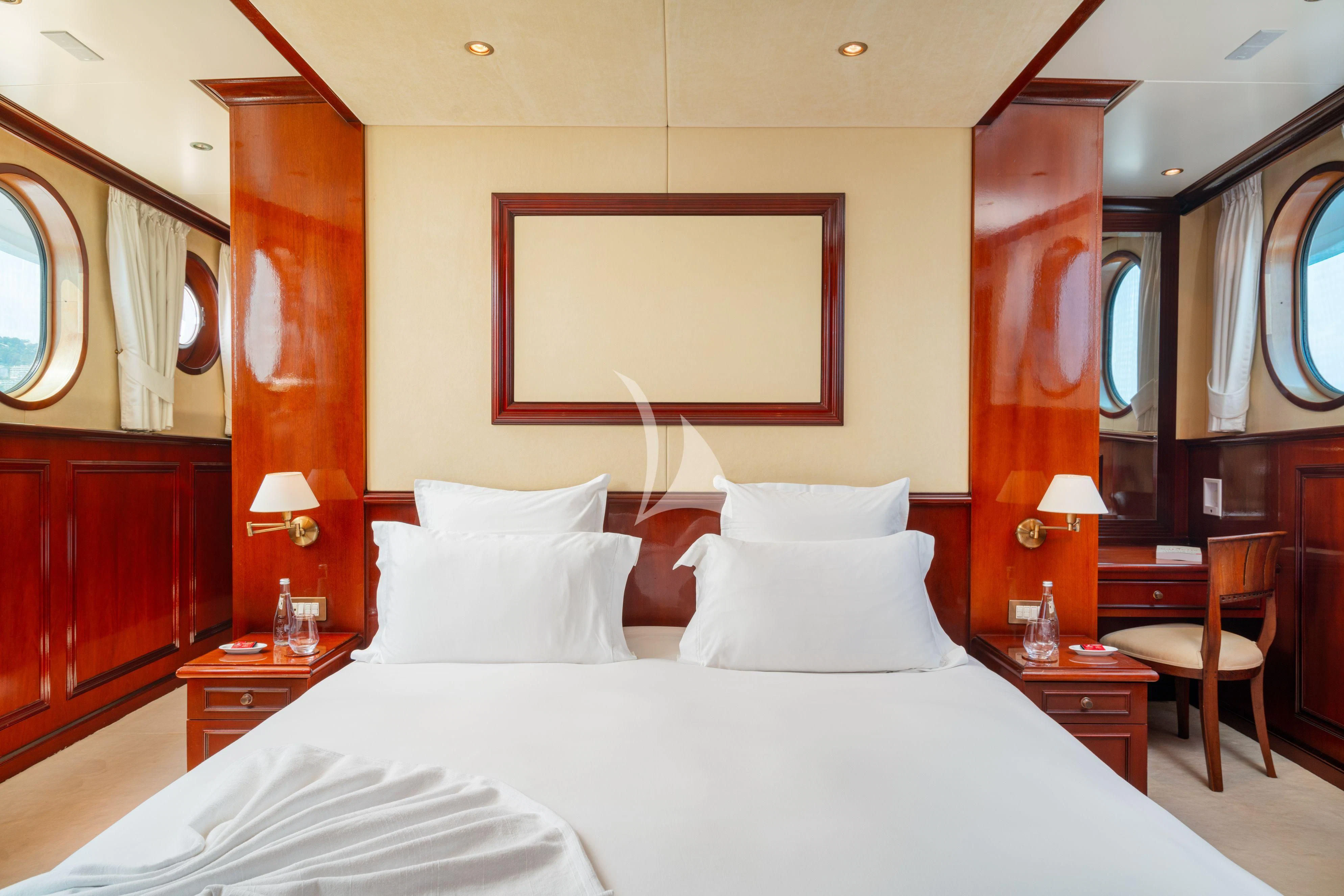 a large bed with white sheets aboard SEA LION Yacht for Sale
