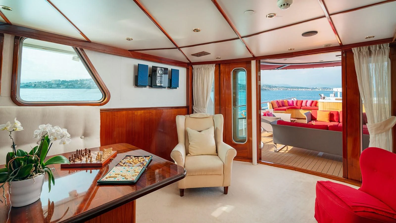 a room with a table chairs and a view of the ocean aboard SEA LION Yacht for Sale