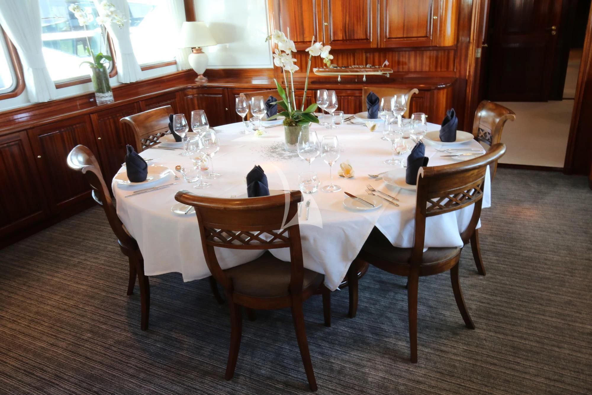 a table set with dinnerware aboard SEA LION Yacht for Sale