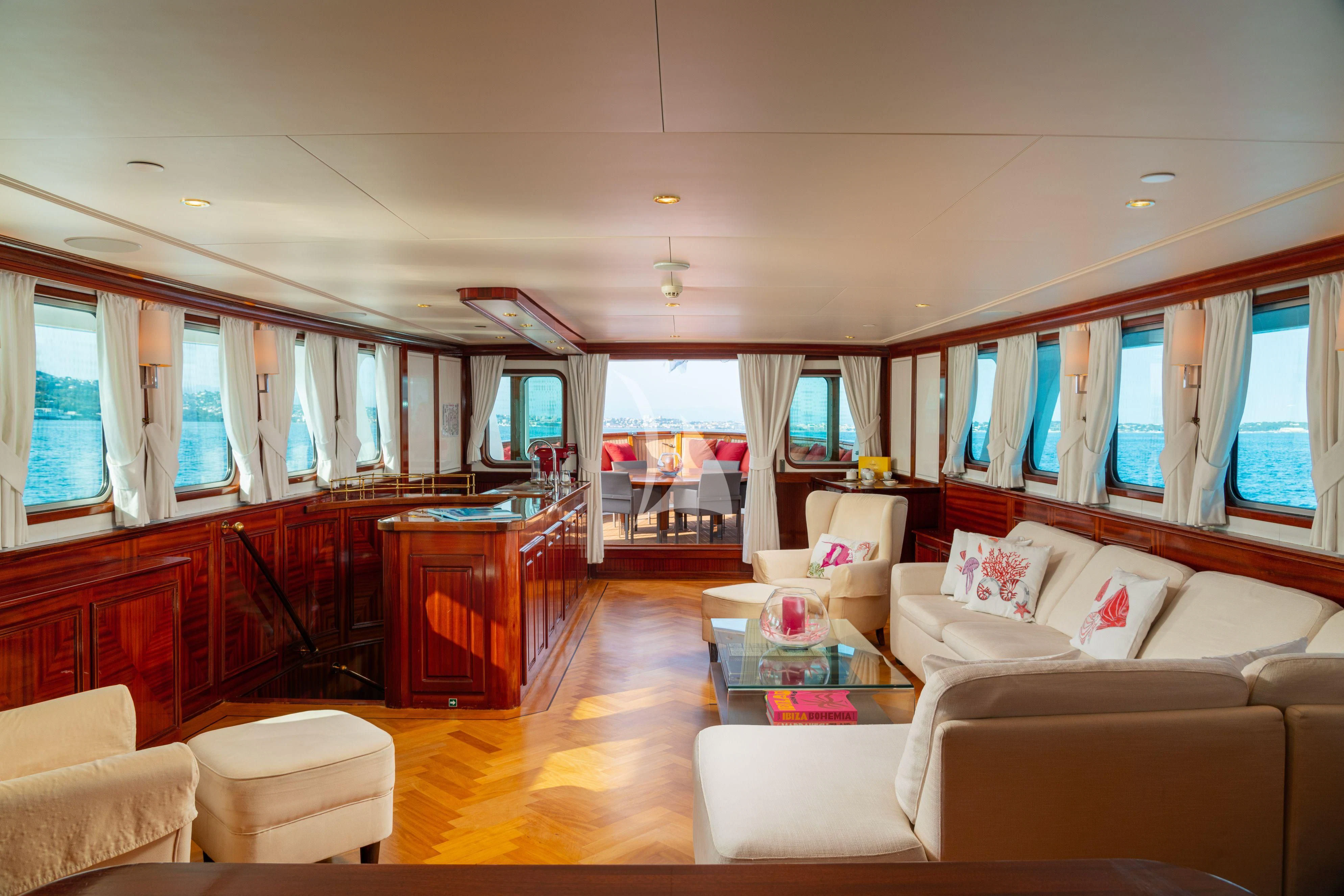 a living room with a large window aboard SEA LION Yacht for Sale