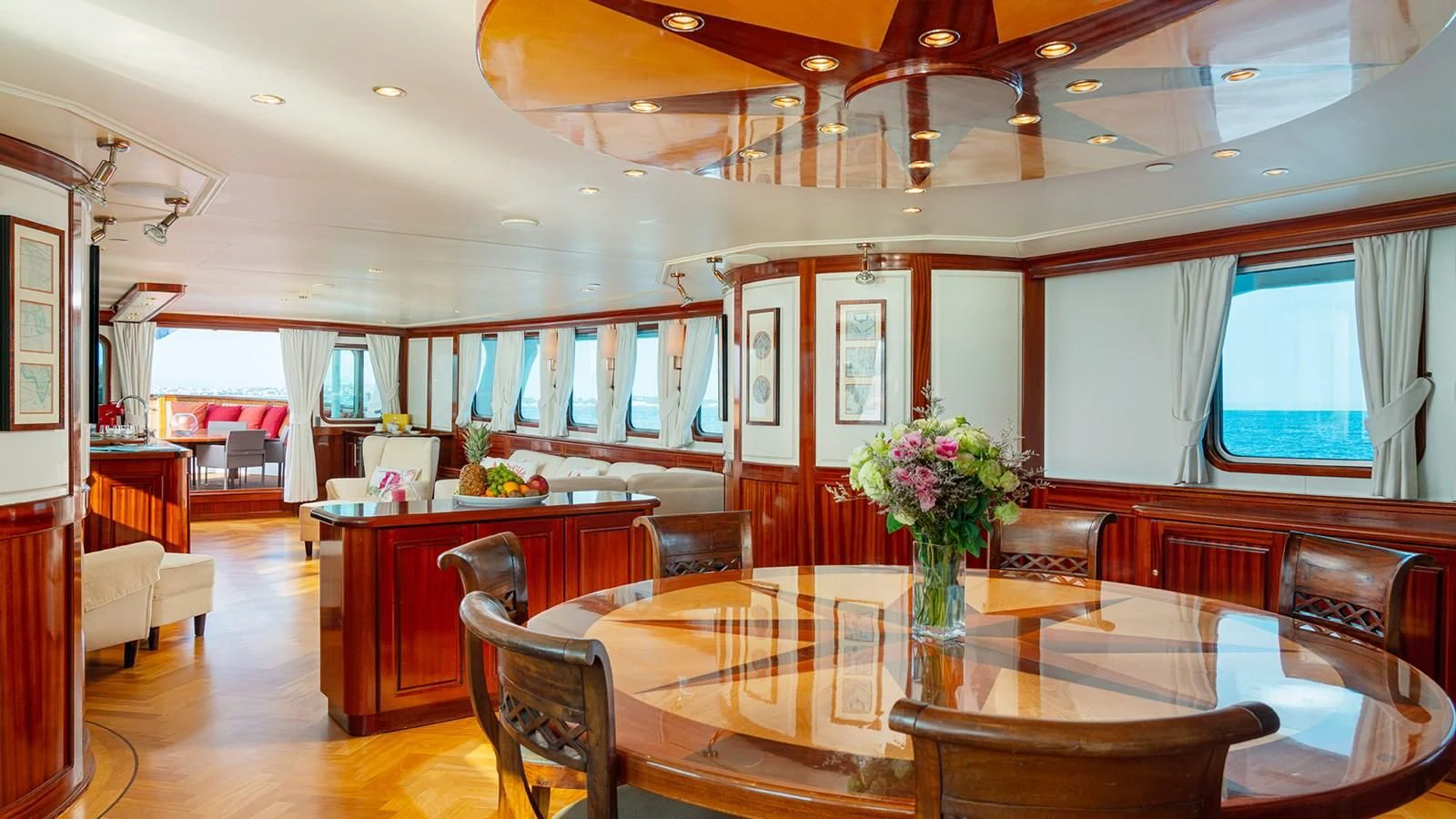 a large room with tables and chairs aboard SEA LION Yacht for Sale